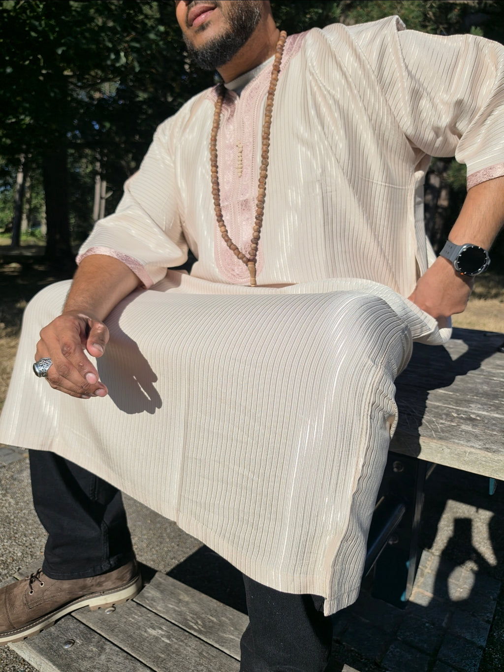 Side profile of the chai Gandoura showing the relaxed, loose fit