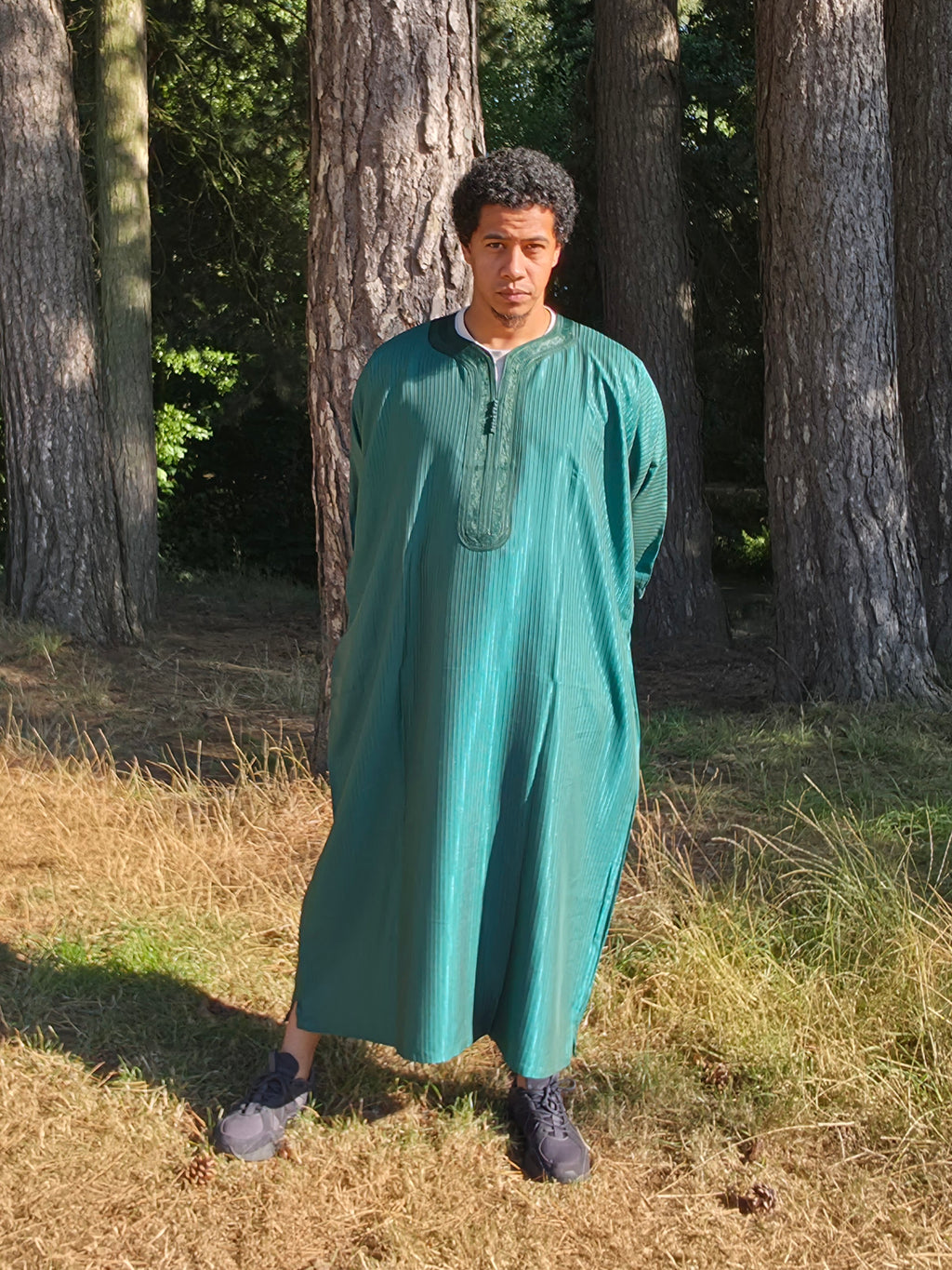 Full front view of the forest green Gandoura, made in Morocco