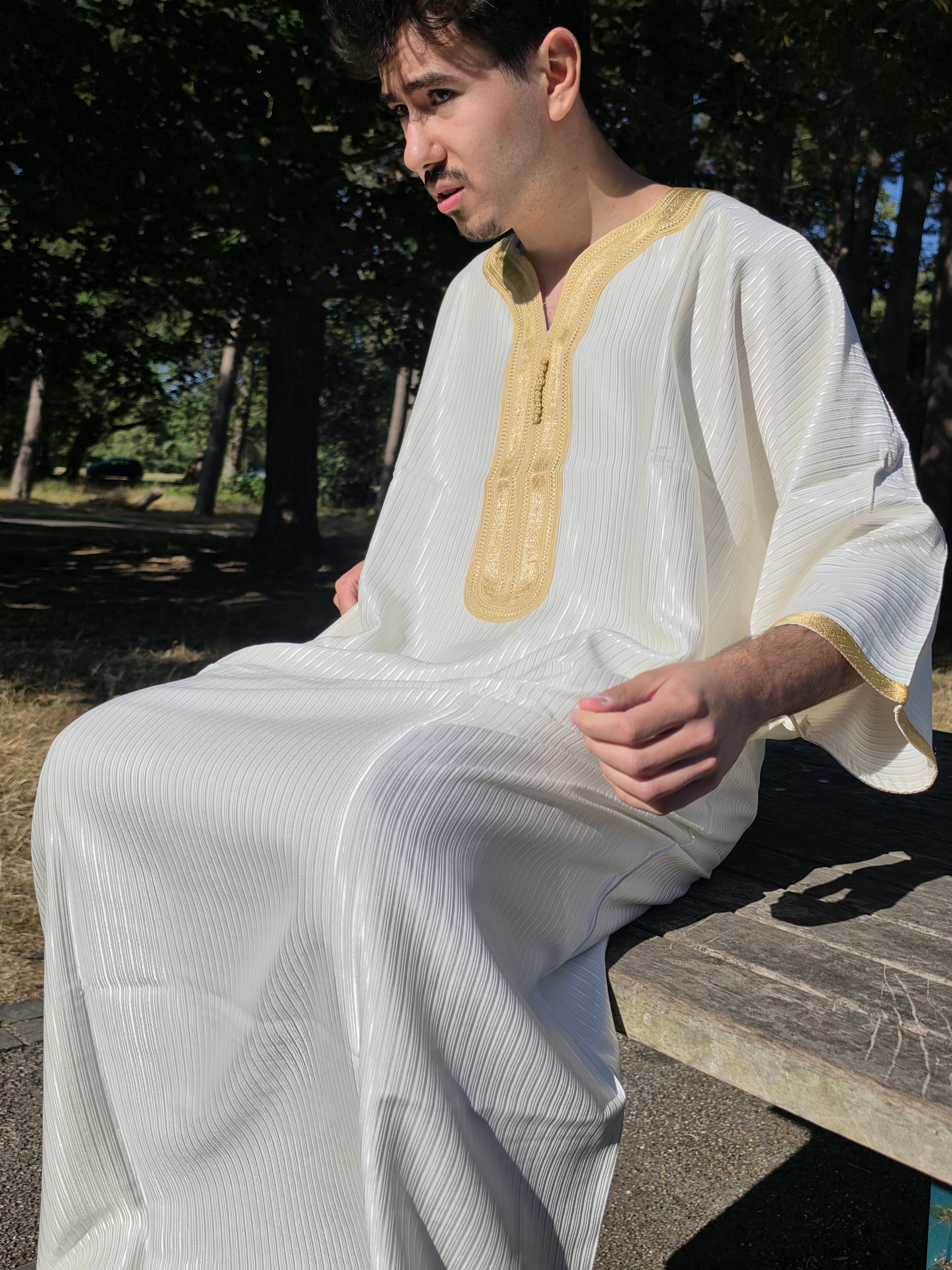 Side profile of the white gold Gandoura showing the relaxed, loose fit